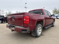 AMVIC Licensed Dealer This 2018 Chevrolet Silverado 1500 2LT is finished in striking Cajun Red Tintc... (image 7)