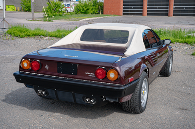 The car is finished Prugna Metallizzato over beige leather upholstery and is powered by a 2.9-liter...