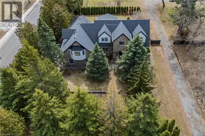 Gorgeous and spacious 2-storey home set on a large, beautifully treed raised private lot, offering 5...