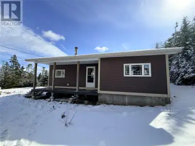 Welcome to this cozy 2-bedroom coastal cottage located at 48 Main Road in Hopeall, Newfoundland, jus...