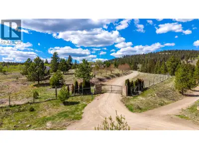 Spanning 55 acres within the ALR with active farm status, this expansive property offers a rare comb...