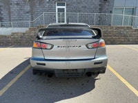 This 2014 Mitsubishi Lancer Evolution delivers pure performance with its turbocharged 2.0L engine, a... (image 4)