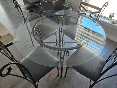 Glass table 45" with 4 chairs in very good condition. $100