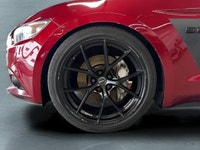 The 2016 Ford Mustang GT in vibrant red with a rear-wheel-drive setup promises dynamic handling and... (image 5)