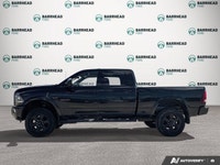 The 2016 Ram 2500 Laramie, finished in an elegant black exterior paired with a sophisticated black i... (image 2)