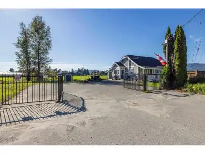 Private gated country living on 1.3 flat acres with mountain views and slough access to Hatzic Lake!...