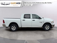 Presenting the stunning 2023 Ram 1500 Classic SLT 4x4 Crew Cab in an elegant White finish, paired wi... (image 1)