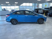 The 2014 Ford Focus SE is a fuel-efficient and compact sedan that's perfect for daily commuting and... (image 5)