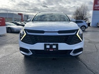 Awarded an IIHS Top Safety Pick, the 2023 Kia Sportage LX in striking Snow White Pearl ensures peace... (image 1)