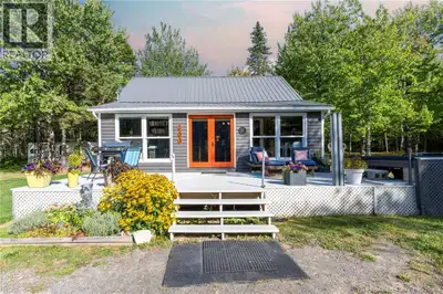 Set on 4.37 acres of trees standing tall, This private retreat has beauty for all. A landscaped gem...