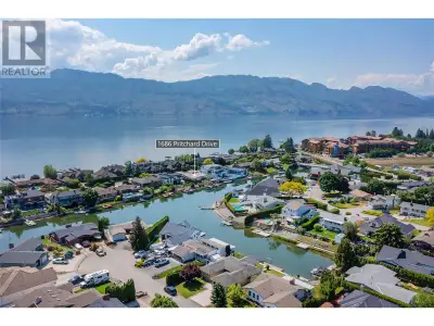 Waterfront living with 2 boat slips on one of West Kelowna's most prestigious roads. This home is si...