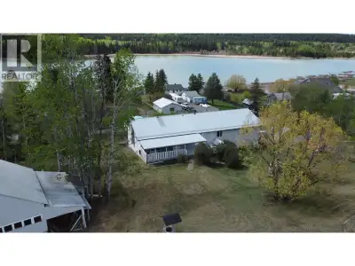 Wake up to beautiful lake views from this impressive 4-bedroom, 4-bath home on a landscaped 1-acre c...
