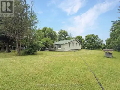 Nestled on a generous 1.04-acre lot of lush, open grassland, this country bungalow offers a perfect...