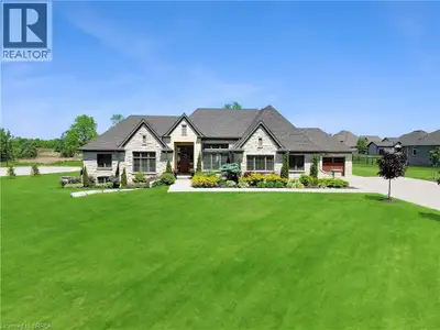 Welcome to 18 Harper Blvd, a luxurious 5-bed, 4-bath stone bungalow nestled on an expansive three-qu...
