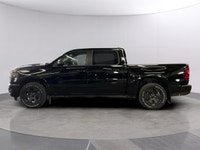 The 2026 Ram 1500 Big Horn 4x4 Crew Cab in a striking black exterior combines rugged durability with... (image 1)
