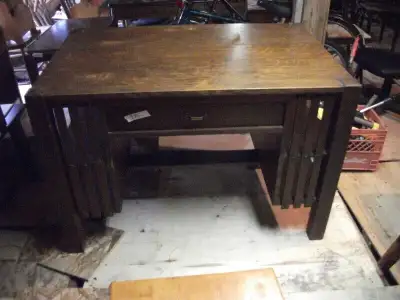Solid oak library from the 20's is a partners table, drawer on both side is 225.00 in good condition...
