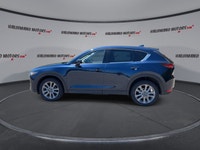 Finished in blue with a black interior, this used 2021 Mazda CX-5 GT AWD brings together upscale com... (image 4)