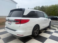 A spacious family minivan with comfortable seating, advanced safety features, and practical convenie... (image 3)