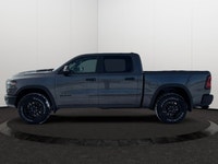 This 2026 RAM 1500 REBEL CREW CAB 4X4 has the following options Lux Leather Trimmed Bucket Seats, Re... (image 1)