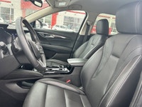 The 2023 Buick Envision Essence, presented in a sophisticated Gray finish, masterfully blends luxuri... (image 4)