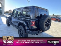This Jeep Wrangler delivers a Gas/Electric V-6 3.6 L/220 engine powering this Automatic transmission... (image 4)