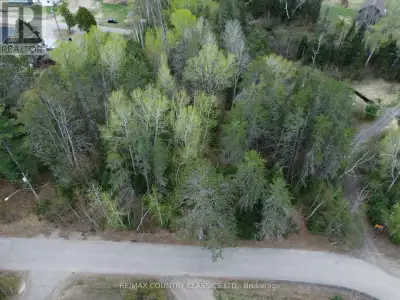 Barry's Bay: Distinctive uniquely shaped 2.48-acre lot. Features a winding creek and mature trees, s...