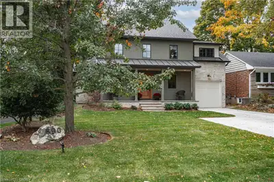A thoughtfully designed family home in Aldershot South, set against a backdrop of mature trees with...