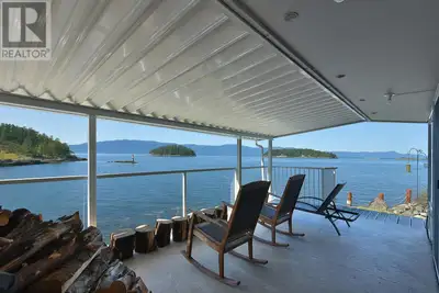Experience the beauty of the ocean with this stunning low bank waterfront property. Step inside and...