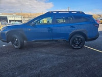 The 2022 Subaru Outback Wilderness in a striking blue finish with an all-wheel-drive system is your... (image 2)