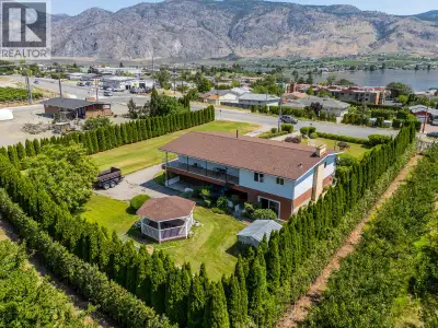 OSOYOOS RANCHER WITH WALKOUT BASEMENT, LAKE VIEWS & ORCHARD SURROUNDINGS. Enjoy the beauty of the So...