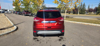 Our 2015 Ford Escape Titanium in Sunset Orange is in stock and ready for your driveway! Call to book... (image 3)