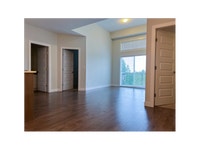 Each suite includes a stainless-steel fridge, stove, dishwasher, and microwave by Whirlpool, as well... (image 6)