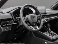 The 2025 Black Honda CR-V Hybrid Touring AWD is your gateway to balanced power and superior handling... (image 8)
