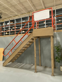 USED Solid steel stairs for mezzanine with landing platform.