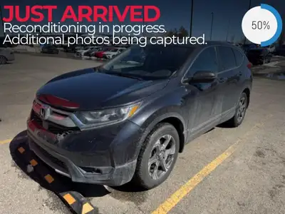 Experience the versatility and comfort of the 2018 Honda CR-V EX-L AWD in a sophisticated gray finis...