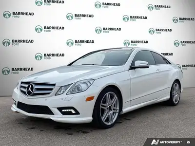 Step into elegance with this 2011 Mercedes-Benz E-Class E 550 Coupe, showcasing a crisp White exteri...