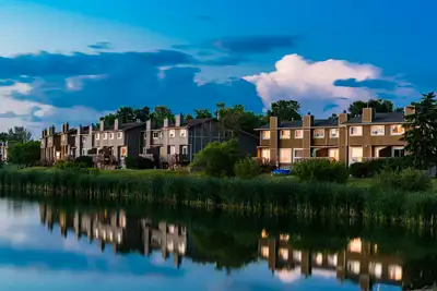 Located in the Tyndall Park neighbourhood, the side by side townhomes overlook a beautiful man-made...