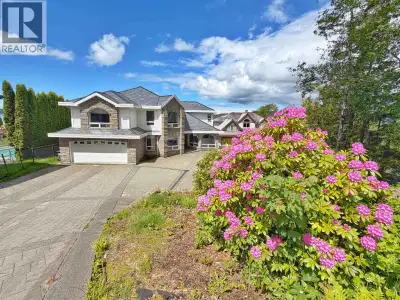 No expense was spared in the building of this stunning executive style view home. Perched on the edg...
