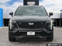 Command the urban landscape with the striking 2025 Cadillac XT4 AWD Sport, featuring the distinctive... (image 1)