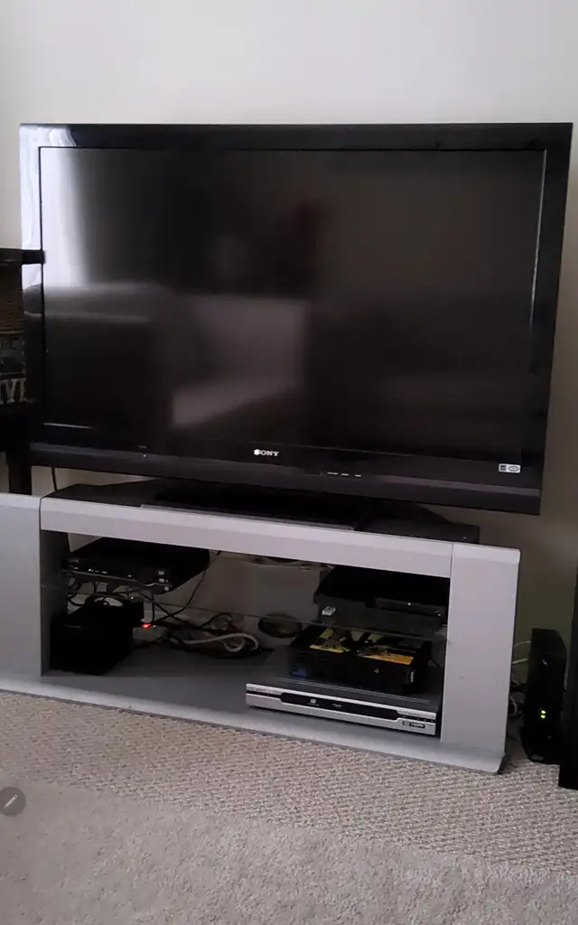 lTV stand with glass shelves for $35.00, L 50"× H 18.5 very good