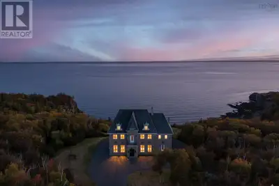 This is more than a fairytale home, it is a once-in-a-lifetime coastal retreat! Perched on a dramati...