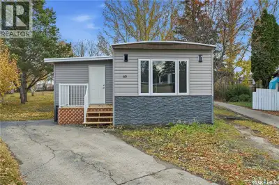 A backyard that feels like your own private park! This beautifully renovated mobile home sits on one...