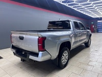 The 2025 Toyota Tacoma SR5, clad in a refined Silver finish, is ready to tackle any terrain with its... (image 9)