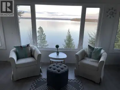 Cozy lakefront cabin with the best views at Cluculz Lake. Beautifully decorated and full of charm, t...