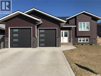 This charming 4-bedroom, 3-bathroom bi-level home is tucked away in a quiet East Flat cul-de-sac. Sp...