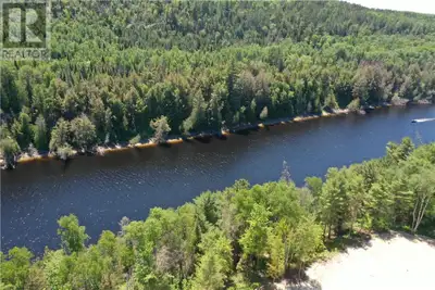 Privacy plus, located on over 6 acres of wooded property on the Spanish River, giving you access to...