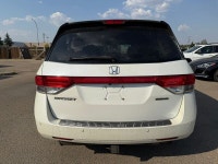 2014 Honda Odyssey Touring — White exterior, Brown interior. This Odyssey is powered by a 3.5L V6 th... (image 5)
