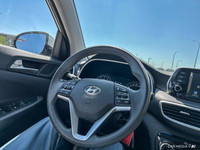 The 2020 Hyundai Tucson in Crystal White features all-wheel drive with advanced safety like lane dep... (image 9)