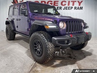 This Jeep Wrangler boasts a Gas/Electric V-6 3.6 L/220 engine powering this Automatic transmission.... (image 6)