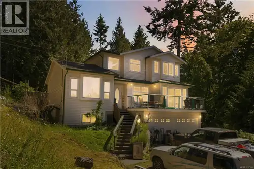 Dreaming of owning acreage with multiple income streams? This East Sooke property offers privacy, fl...